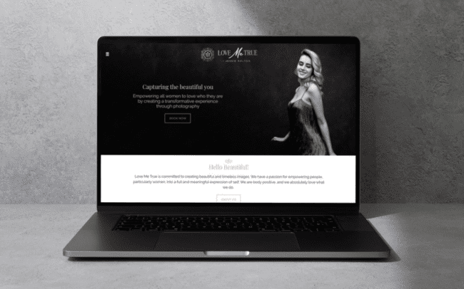 Love Me True website shown on a laptop